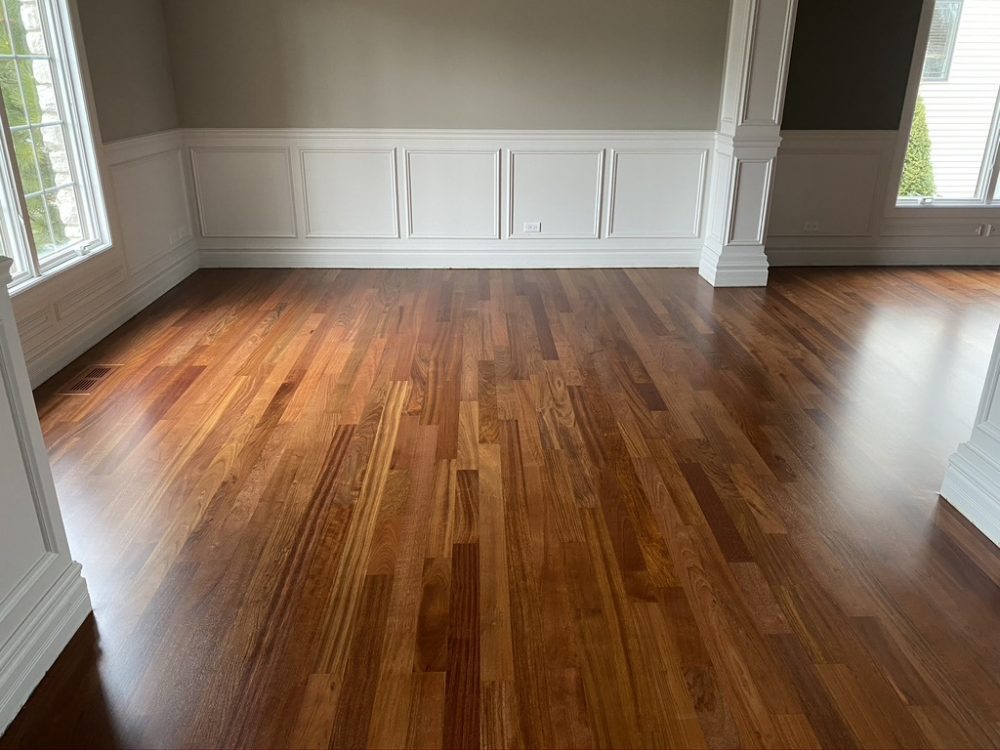 Refinished medium-tone hardwood floor in an empty room