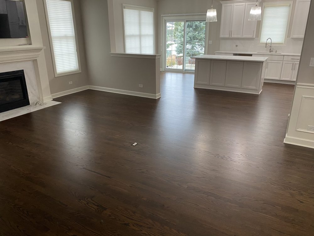 Empty room with dark refinished hardwood floor