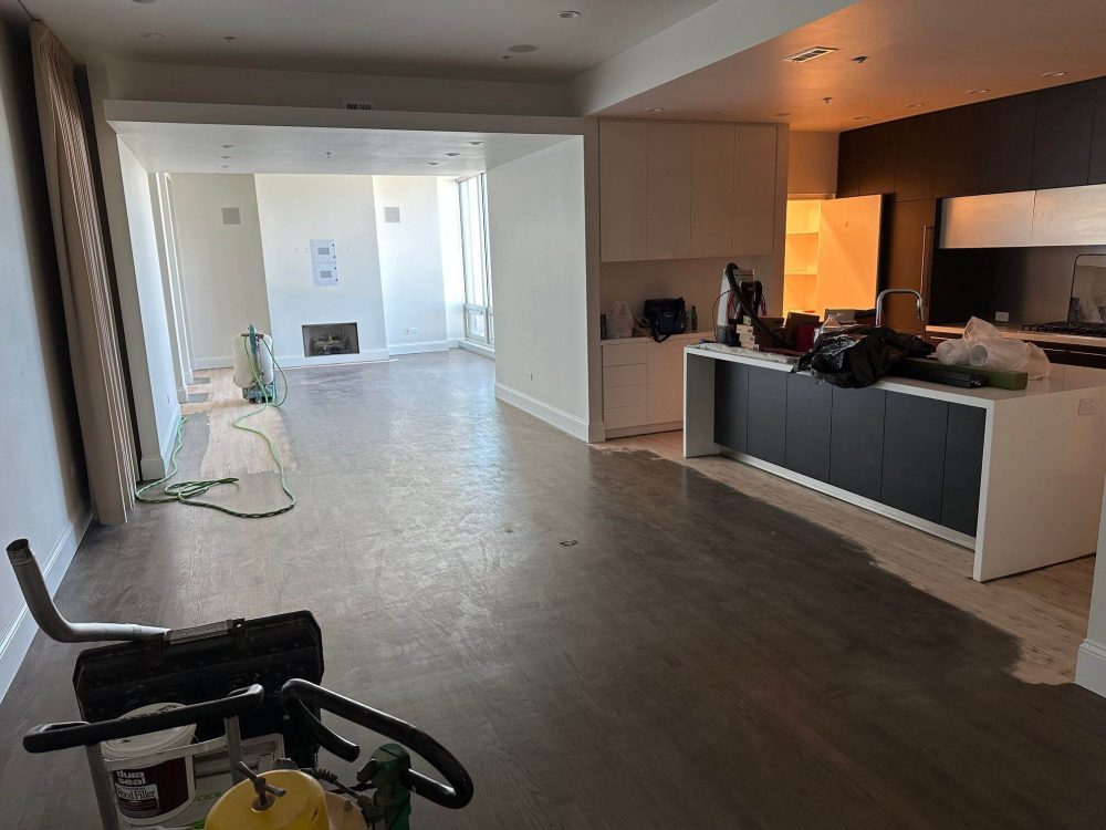 Removing old finish from hardwood floors during sanding and refinishing