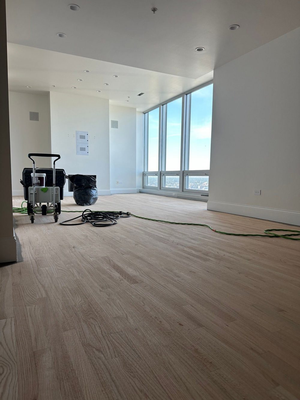 Sanding red oak floors down to raw wood before refinishing