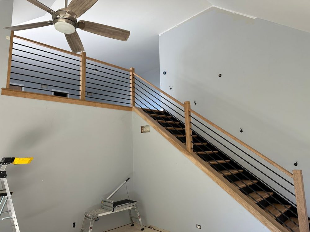 After stair railing installation: white oak posts and horizontal iron spindles in West Chicago, IL