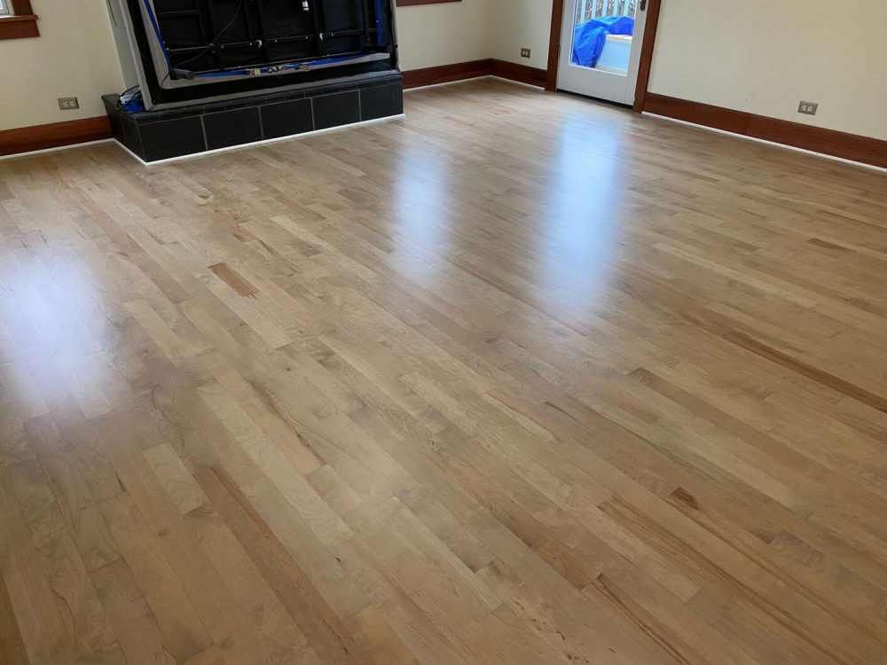 Light natural maple hardwood floor in a large room, with subtle grain variation and a bright finish that works well in clean, open spaces