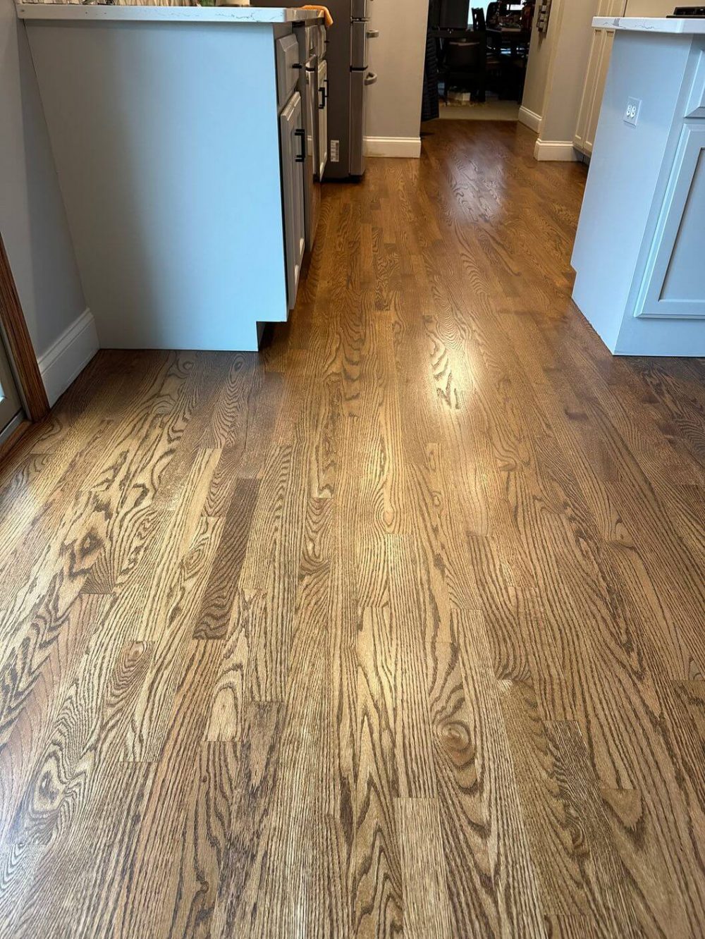 Oak hallway floor after refinishing with Provincial stain and Loba 2K Duo Satin