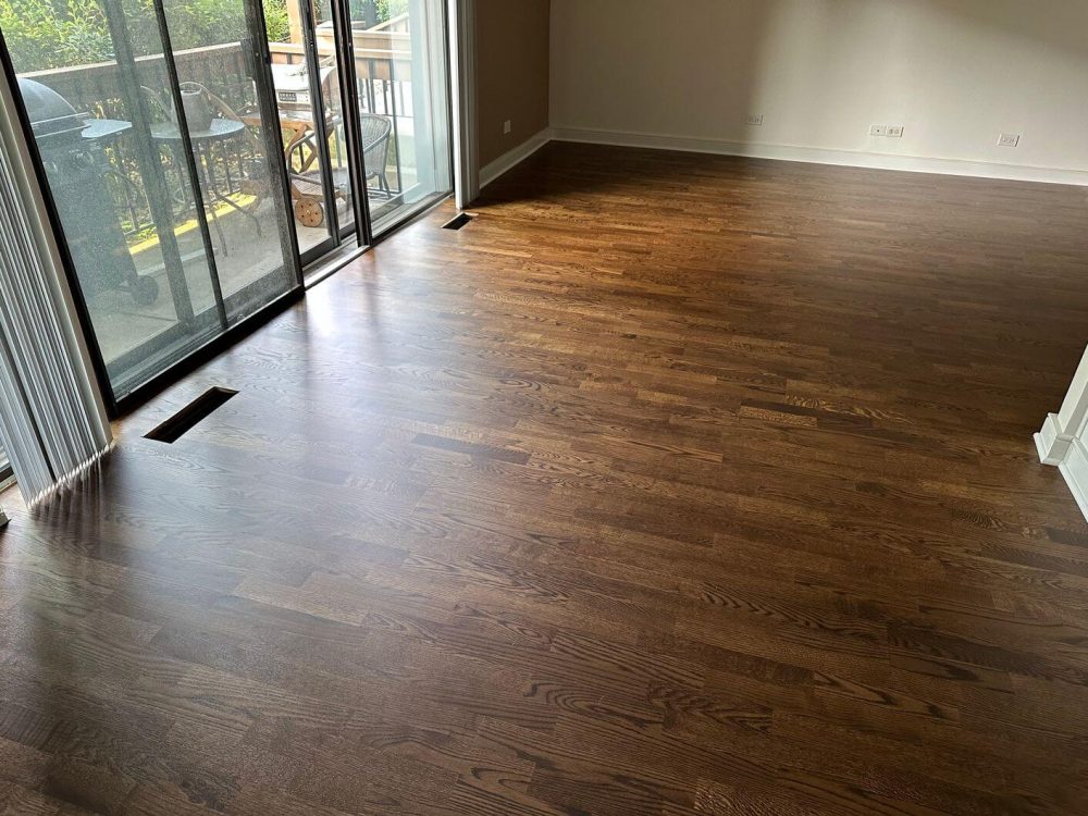 This close after view highlights the darker Espresso stain and the careful finishing work we completed around the floor vent opening.