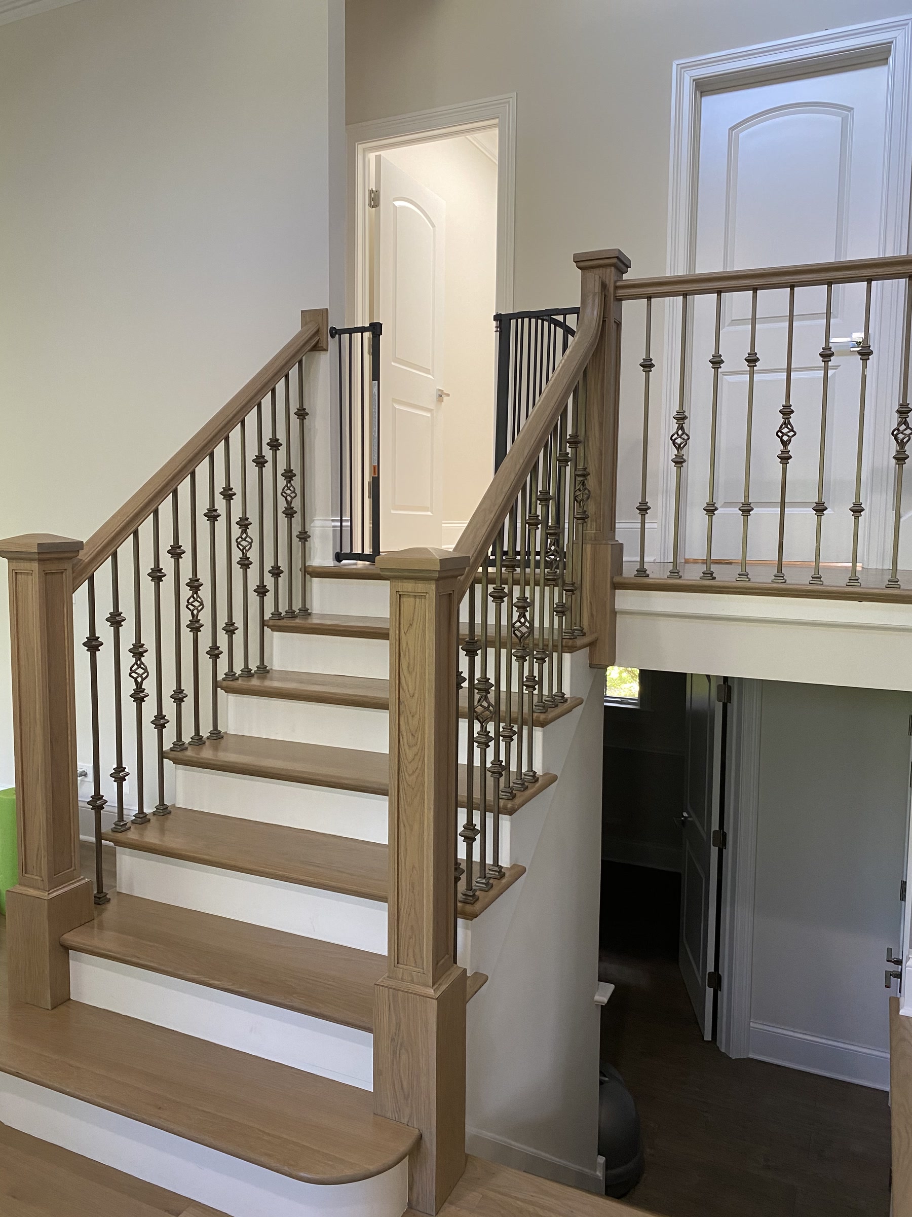 Staircase refinished with silvered grey treads and iron balusters, Arlington Heights, IL