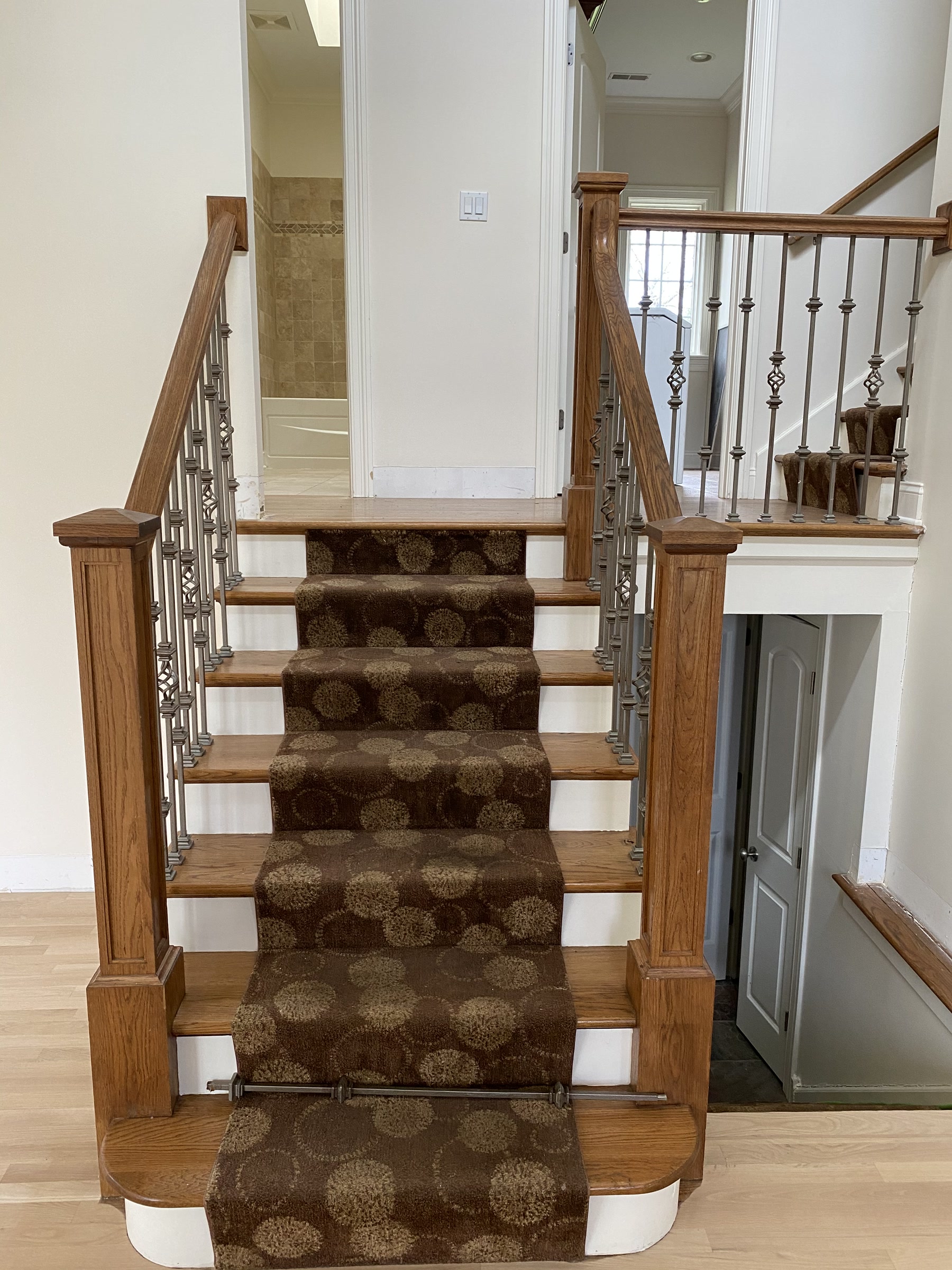 Staircase with a carpet runner before refinishing, Arlington Heights, IL