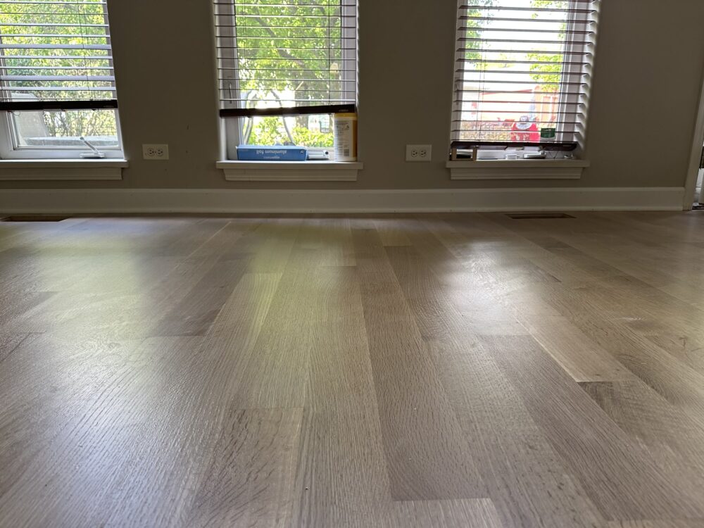 Finished rift-sawn white oak floor in the living room by the windows, Aurora, IL