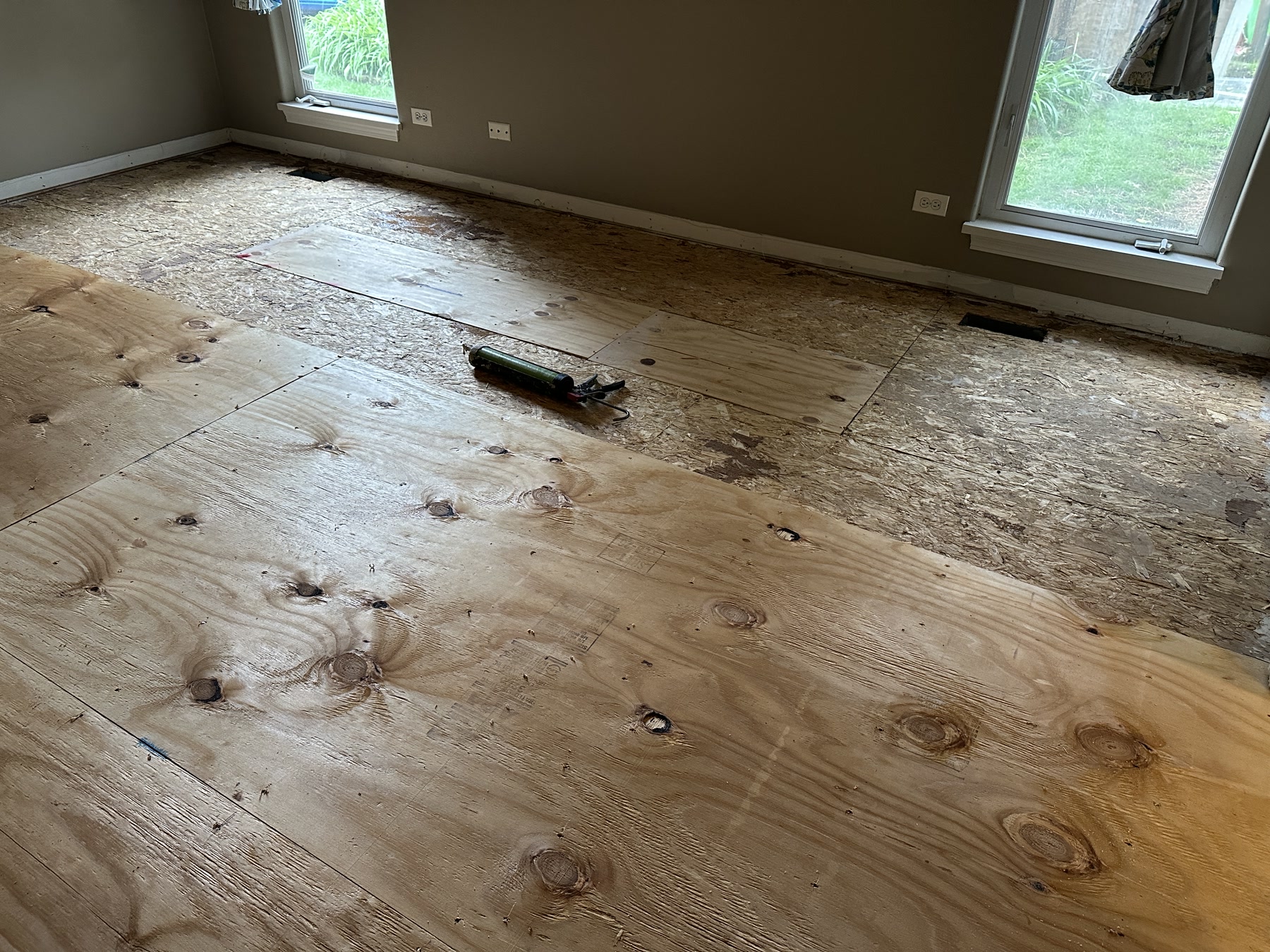 Great room demoed to the bare subfloor before the new white oak installation, Aurora, IL