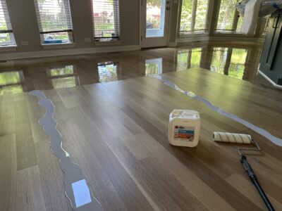 Applying the Bona finish coat to the new white oak floor, Aurora, IL (in-process)
