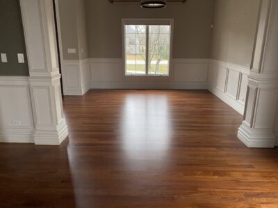 Brazilian cherry floor in the great room with wainscoting and columns, Barrington, IL
