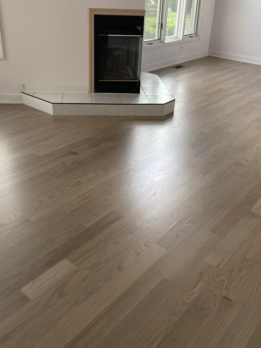 Silvered gray stained hardwood floor in a Barrington room