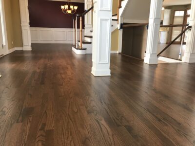 Espresso hardwood floor in a room with a dark accent wall, Batavia, IL