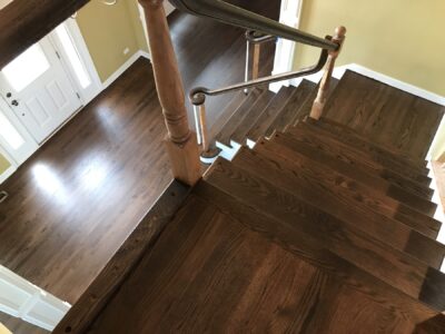 Espresso staircase and landing with a dark handrail, Batavia, IL