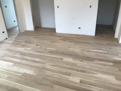 Newly installed natural 5-inch white oak floor before staining, Berwyn, IL