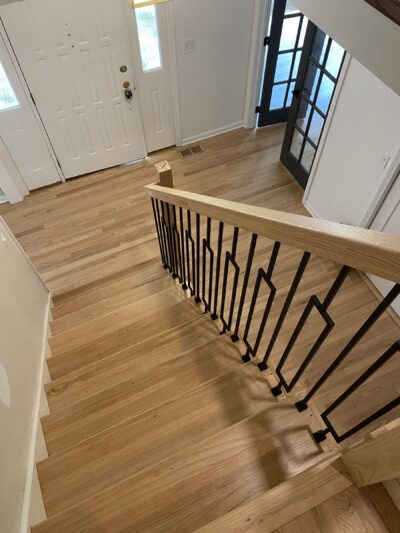 Foyer with white oak floor and an iron-baluster staircase, Burr Ridge, IL