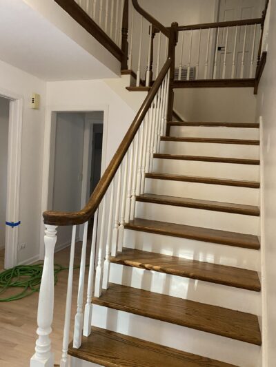 White oak staircase with a wood handrail and white risers, Burr Ridge, IL