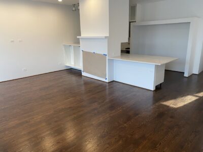Coffee brown hardwood floor by the waterfall kitchen island, Chicago, IL