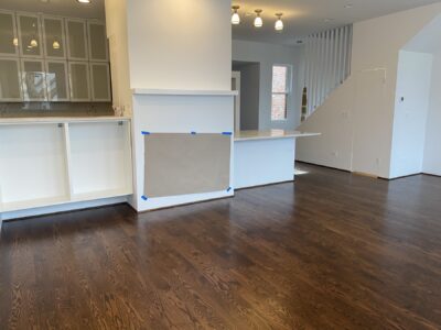 Coffee brown hardwood floor across the open living and kitchen, Chicago, IL