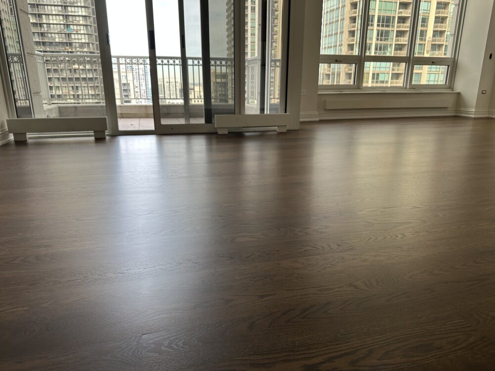 Medium brown engineered white oak floor across the living room, Chicago, IL