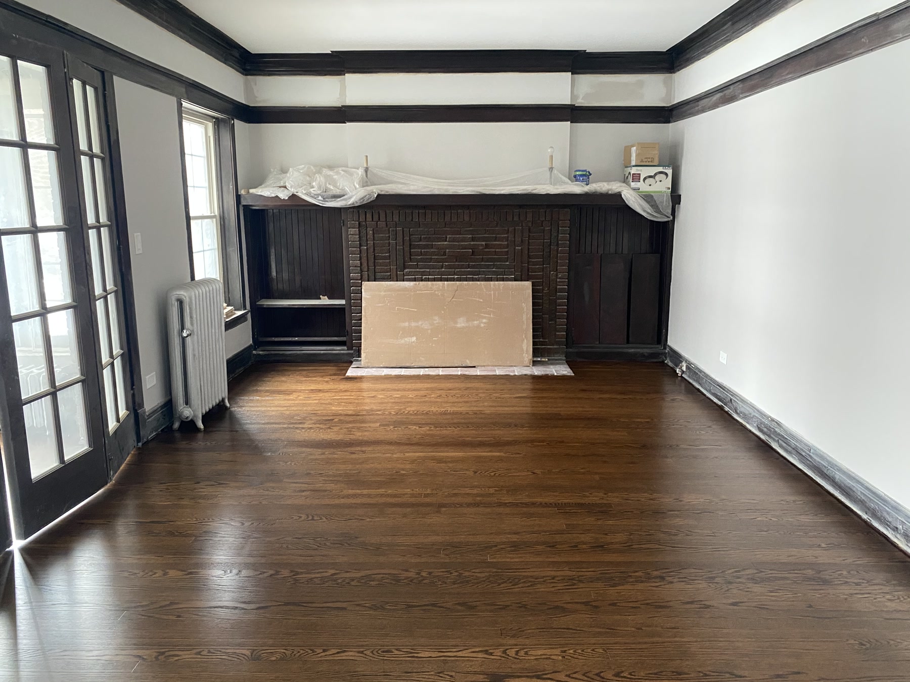 The repaired floor sanded and refinished to a deep, even tone, Chicago, IL