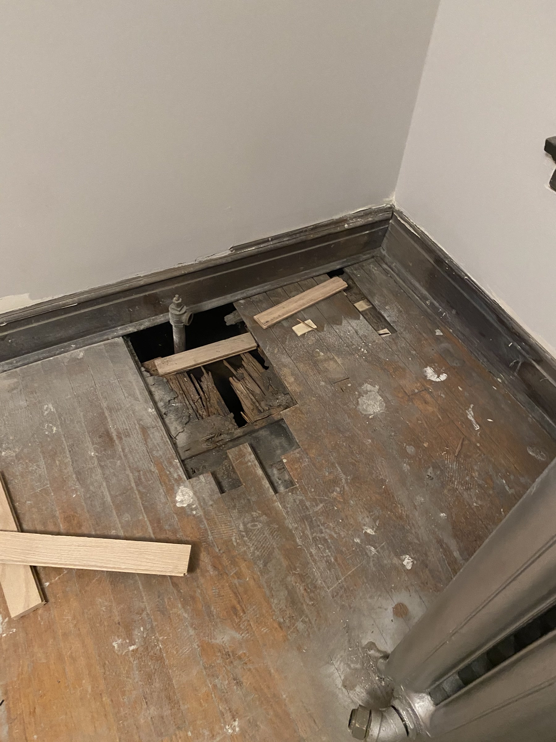 Damaged section of the vintage floor cut out for board replacement, Chicago, IL (in-process)