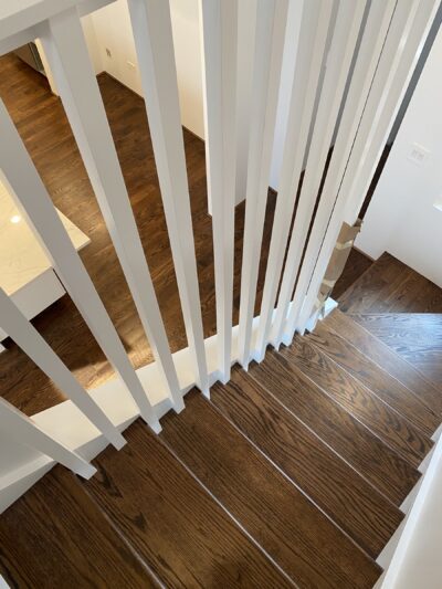 Modern open-riser staircase with coffee brown treads, Chicago, IL