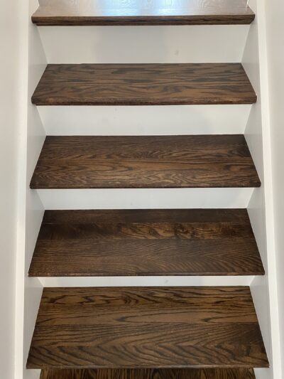 Close view of coffee brown open-riser stair treads, Chicago, IL