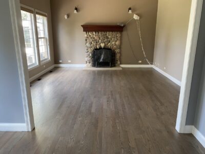 Classic Grey floor in the living room with a stone fireplace, Darien, IL