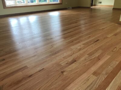 Natural clear-coat floor across the open room, Darien, IL