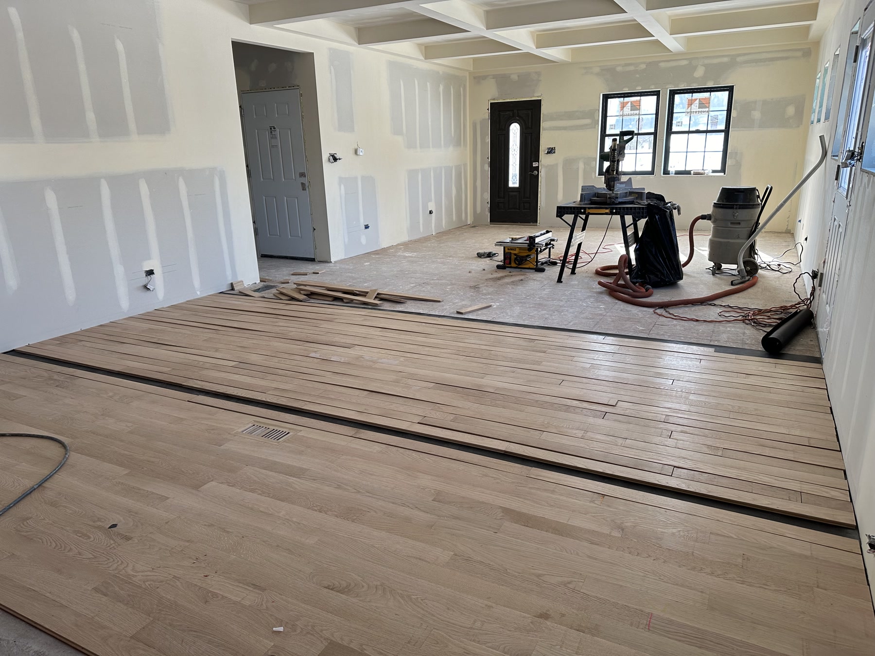 Installing new white oak boards over black paper, Darien, IL (in-process)