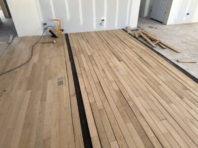 Laying new white oak boards over the underlayment, Darien, IL (in-process)