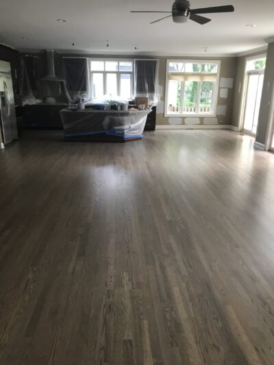 Silvered grey hardwood floor in the great room by the wall of windows, Downers Grove, IL