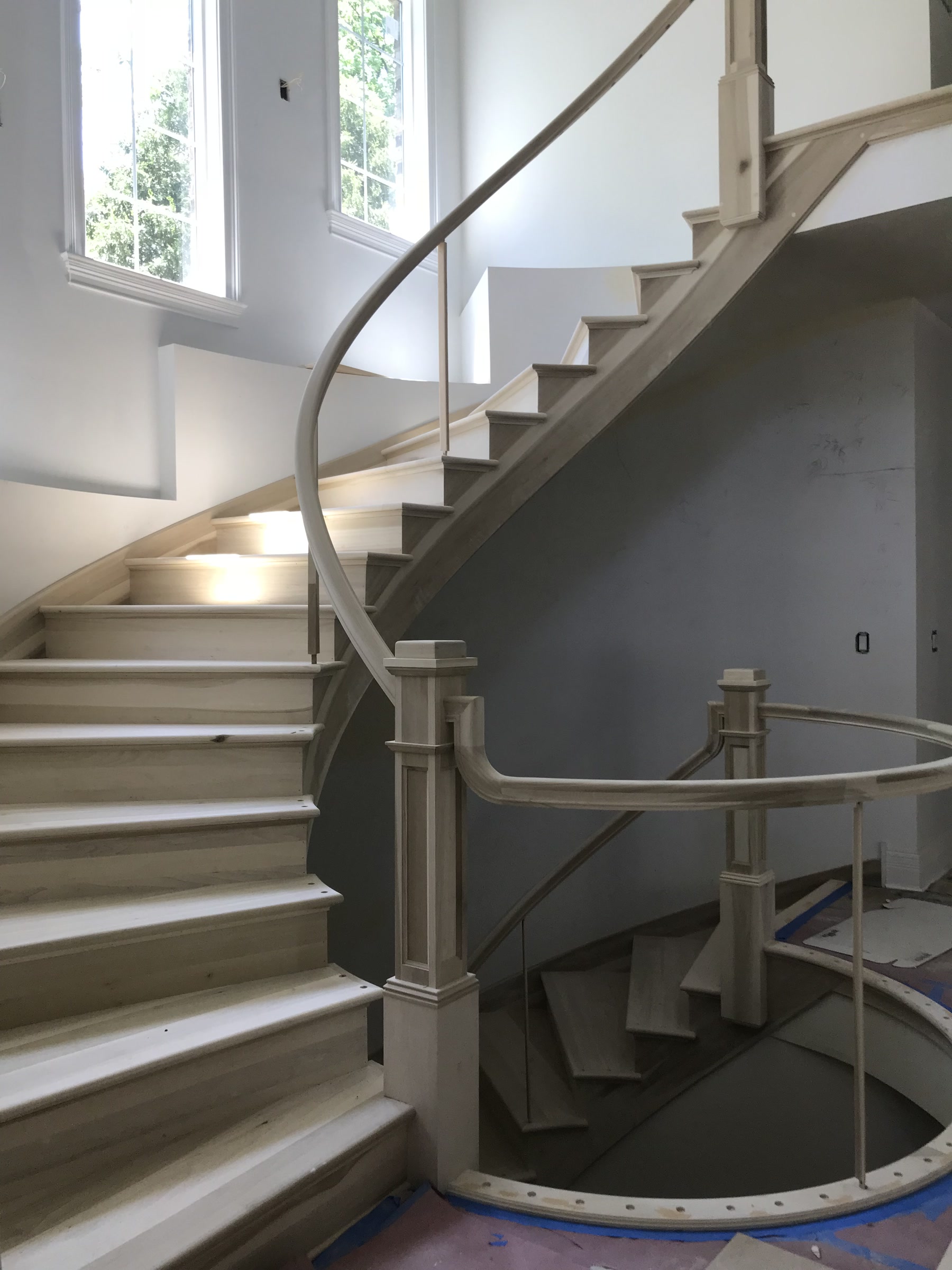 Grand curved staircase with unfinished hardwood treads, Downers Grove, IL (in-process)