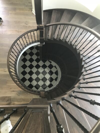 Spiral staircase with dark treads and white risers, Downers Grove, IL