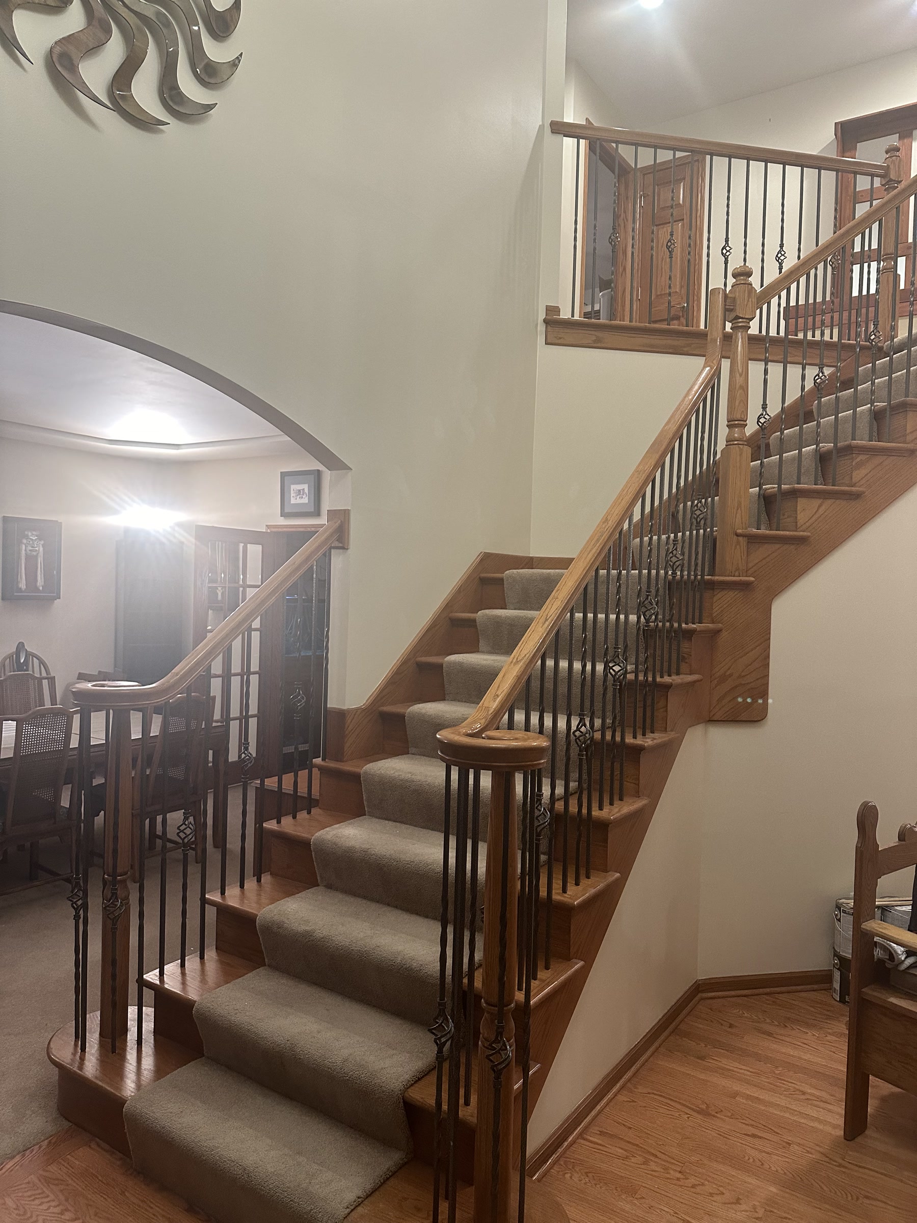Curved staircase with the original balusters before restoration, Elmhurst, IL