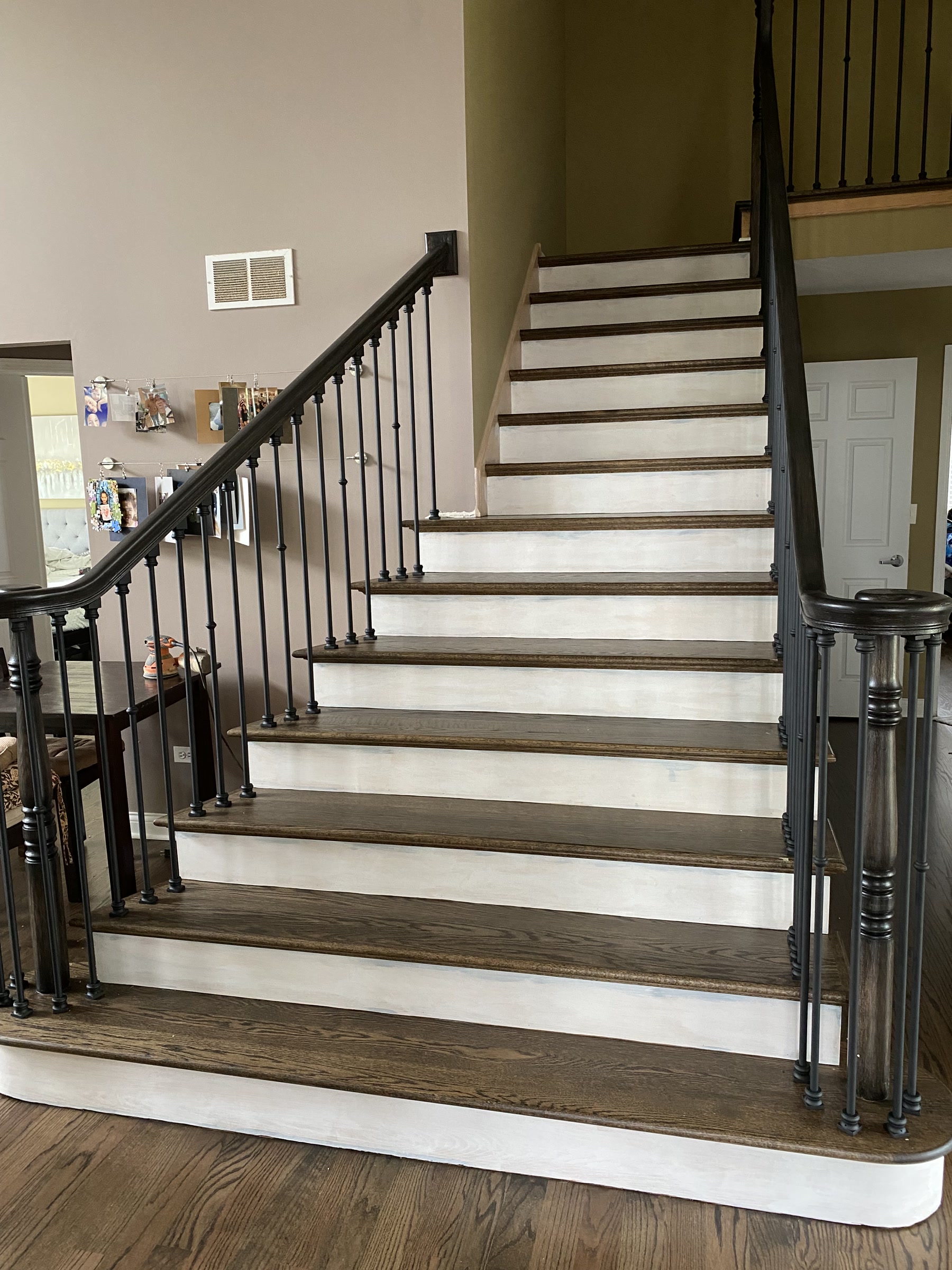 Finished Provincial staircase with white risers and iron balusters, Glenview, IL