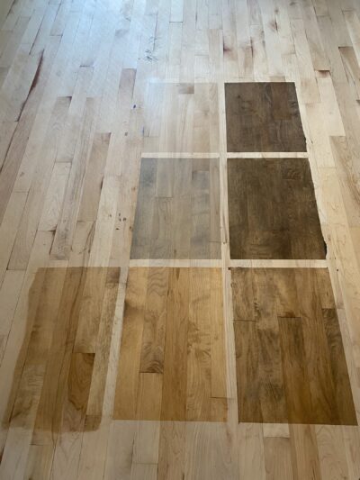 Stain color-test swatches applied on the actual maple floor, Highland Park, IL