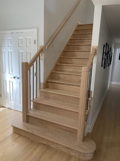 White-wash hardwood staircase with wood handrail and iron balusters, Highland Park, IL