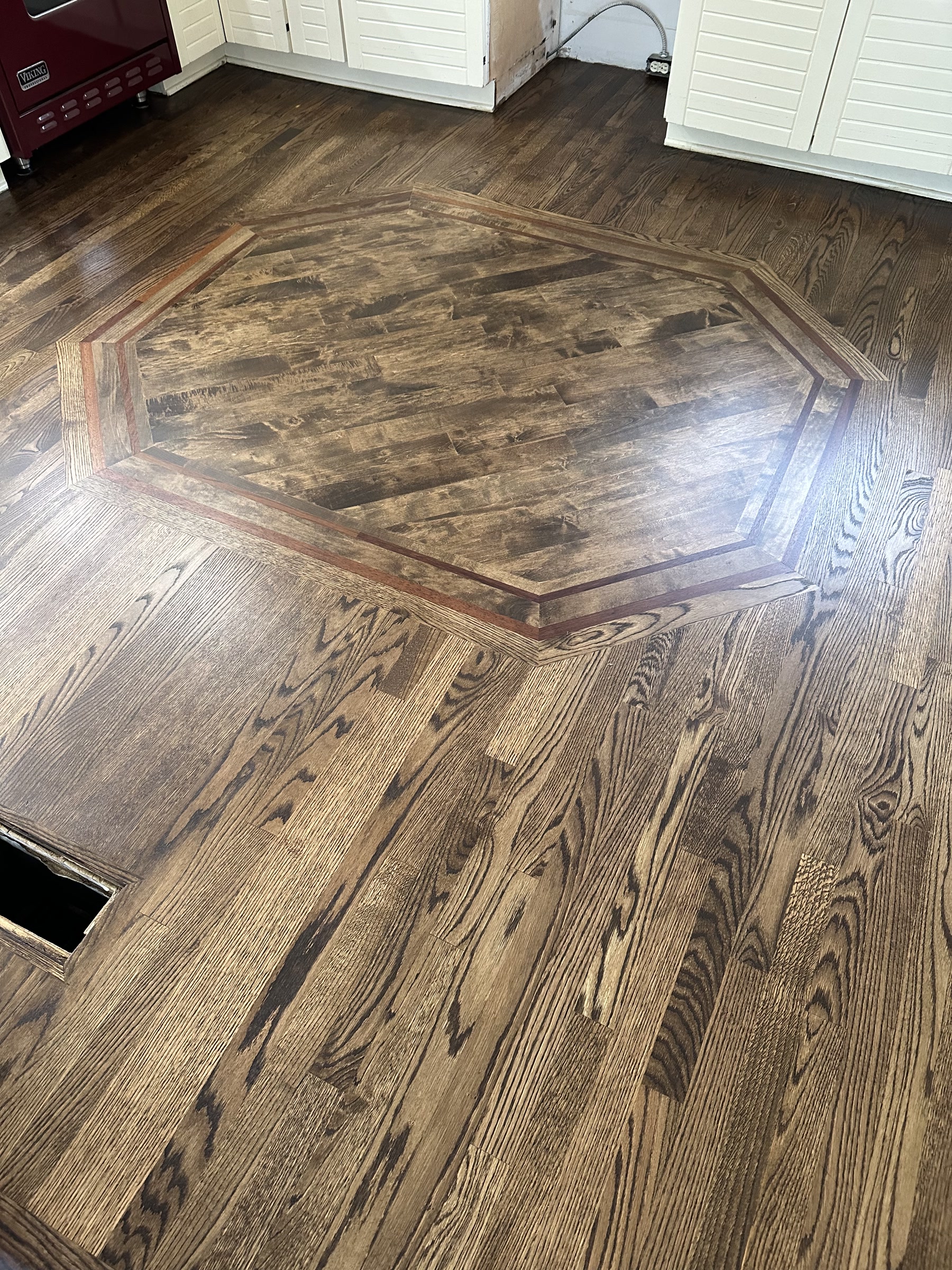 Custom octagon medallion inlay in the Jacobean floor, Hinsdale, IL