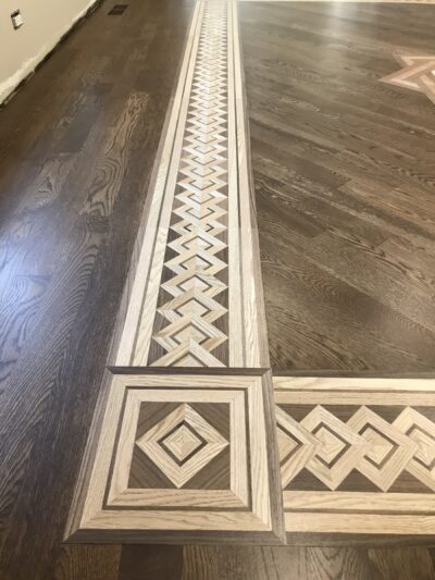 Marquetry hardwood floor with medallion and border in the room, Lemont, IL