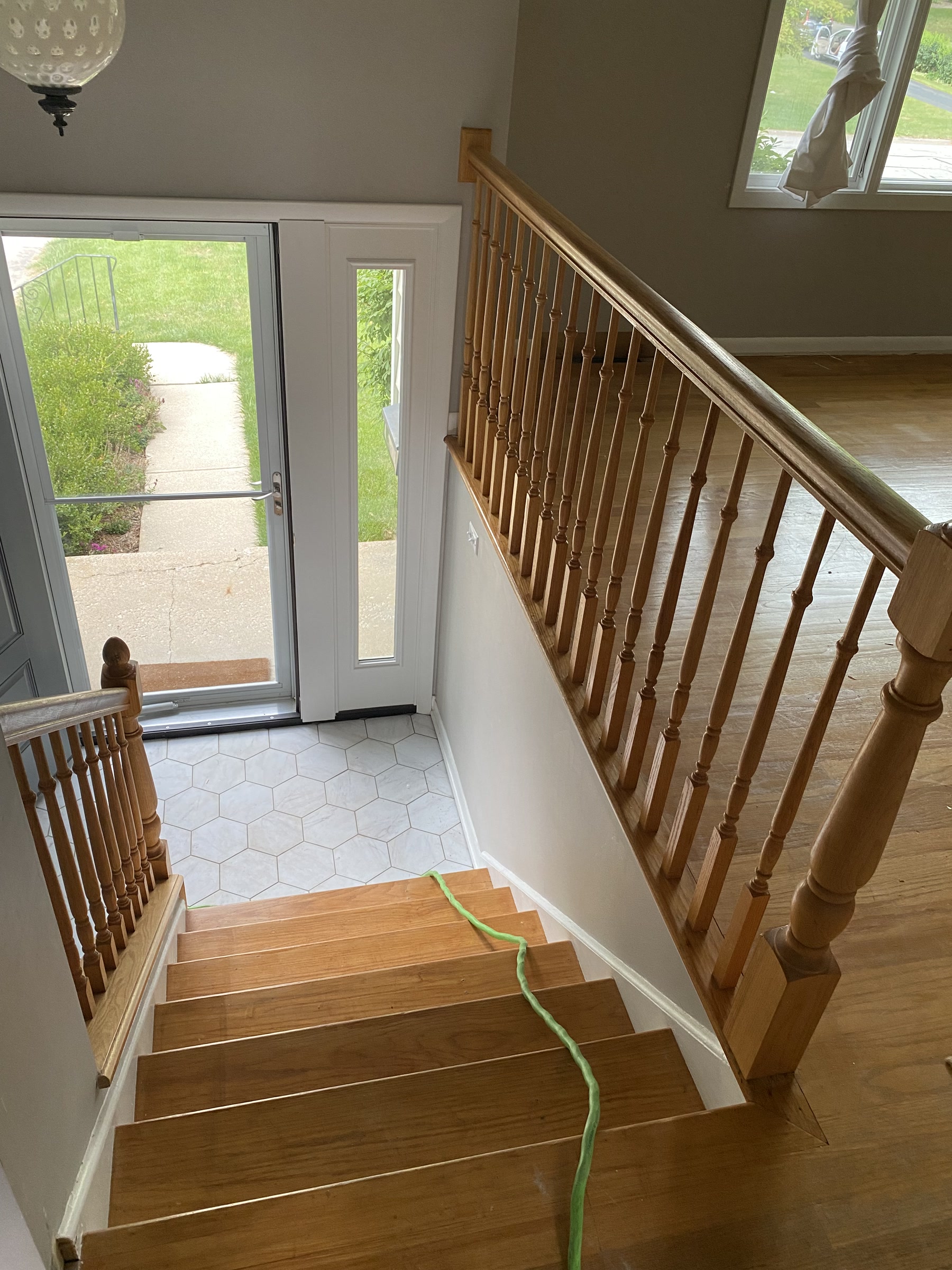 Staircase with the original wood balusters and handrail before replacement, Lisle, IL