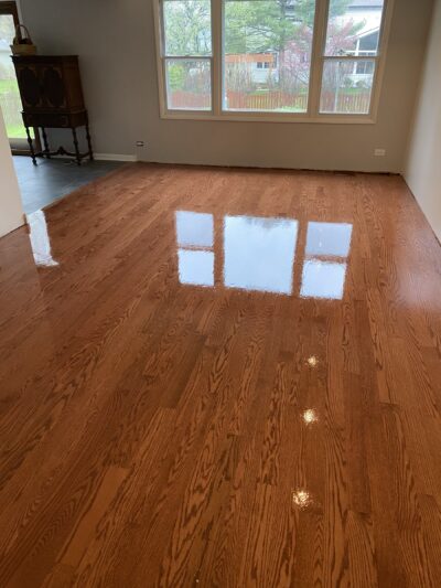 Glossy Gunstock red oak floor by the windows, Naperville, IL