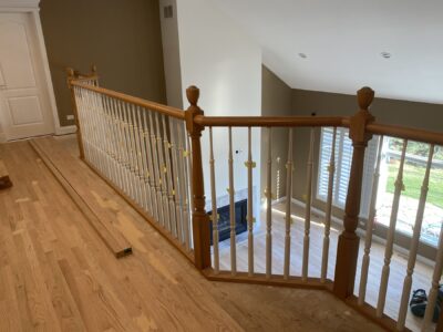 Two-story foyer with wood railings and a light oak floor, Naperville, IL