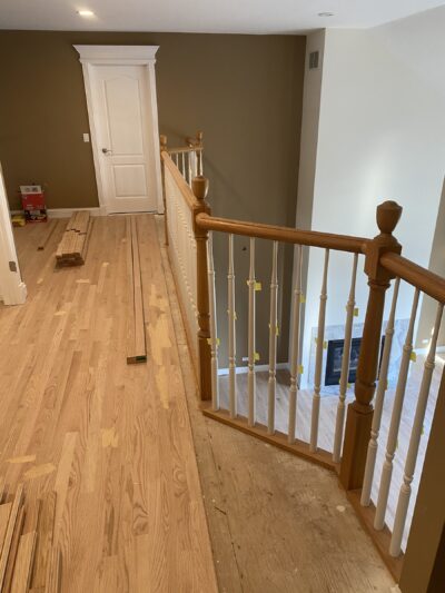 Finished light oak floor and wood railing, Naperville, IL