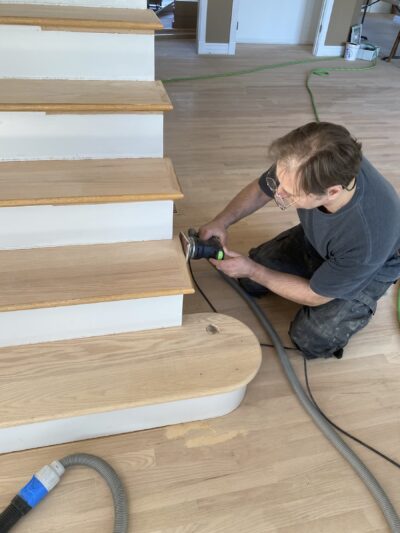 Sanding the oak stair treads mid-project, Naperville, IL (in-process)