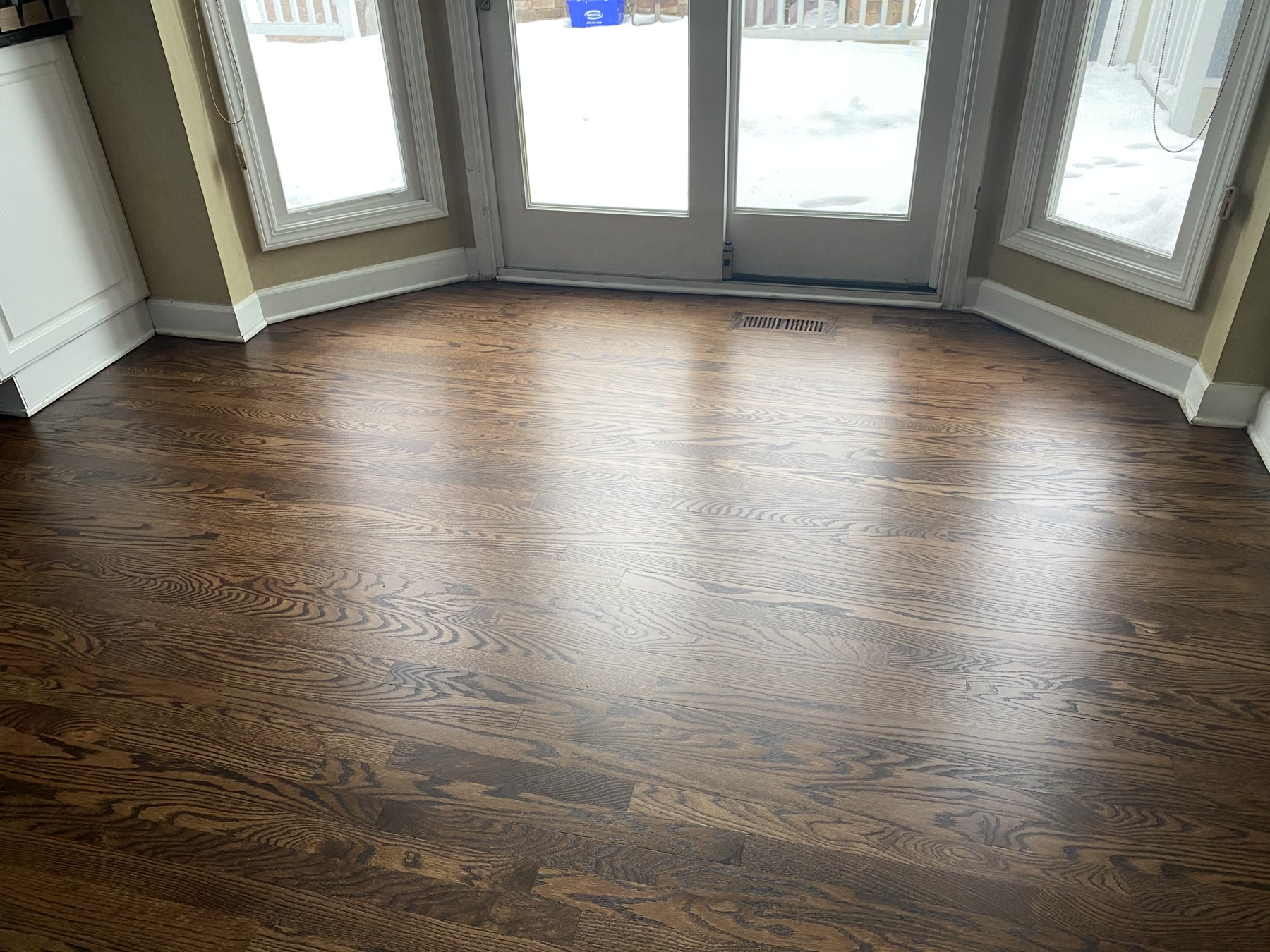 The bay-window room floor refinished a deep Jacobean, Naperville, IL