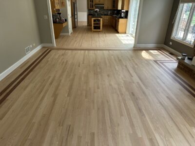 Light red oak floor with a dark border by the kitchen, Orland Park, IL
