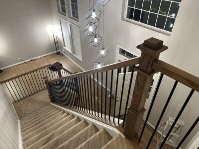 Staircase and landing with black metal balusters from above, Oswego, IL