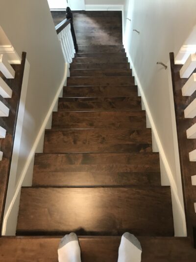 Espresso staircase with white risers and iron balusters, Plainfield, IL