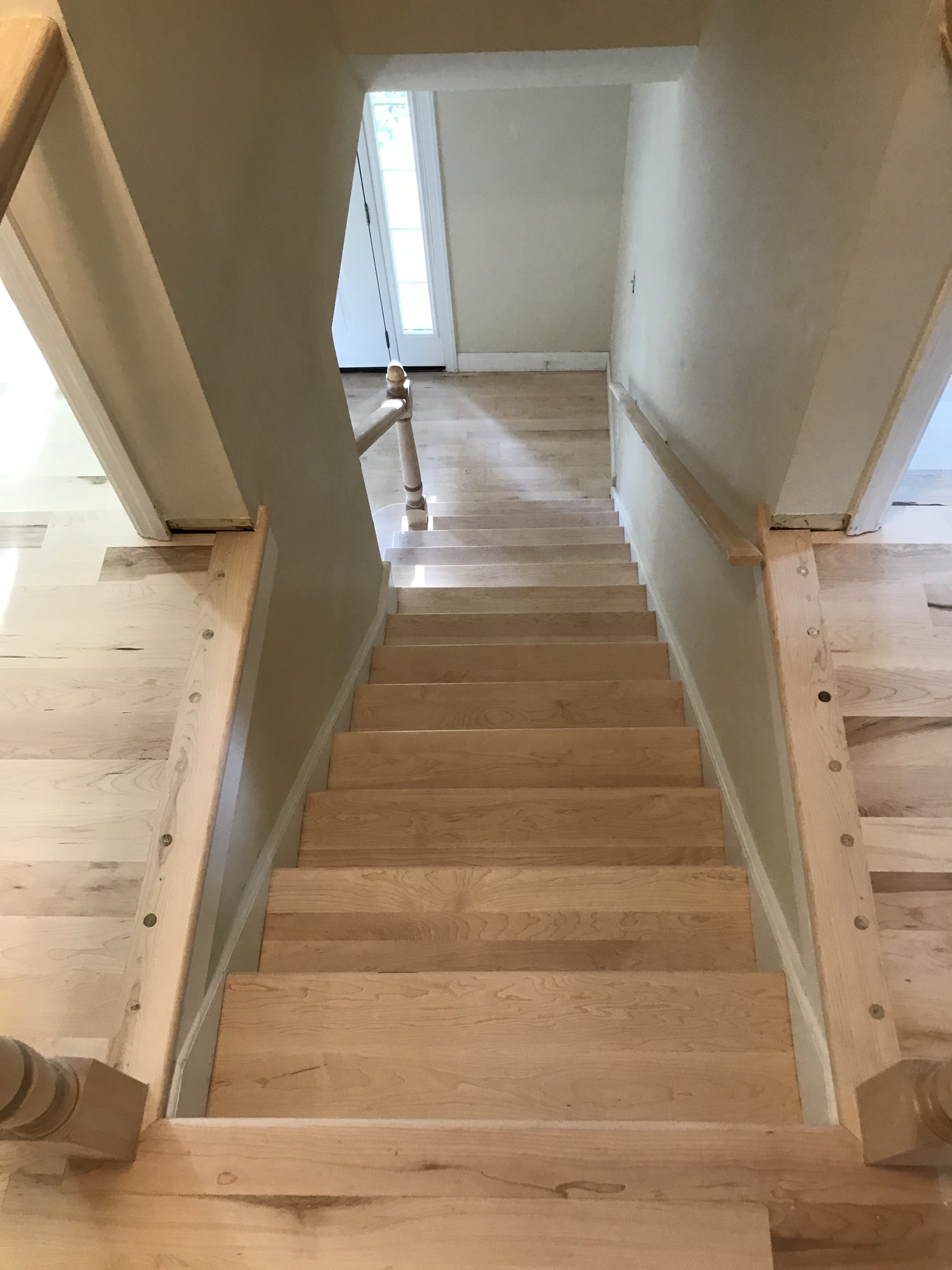 Staircase with bare, sanded treads before espresso finishing, Plainfield, IL (in-process)